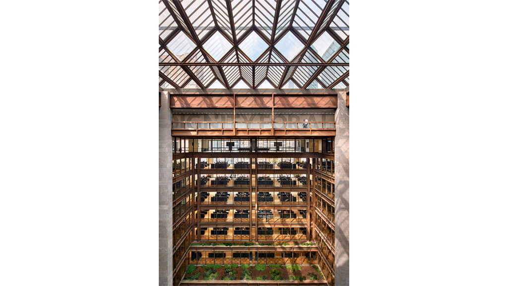 A tall building with a glass front.